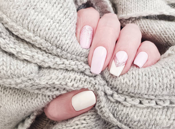 istock female hand beautiful manicure sweater 1172289215