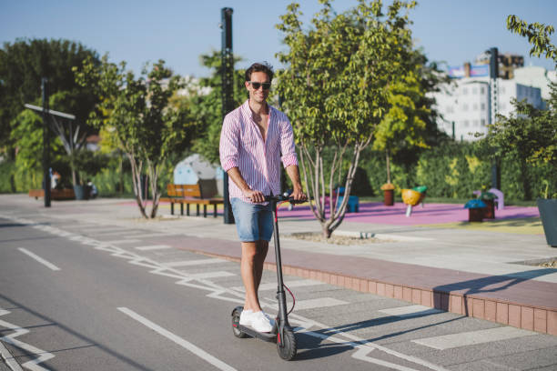istock Young man on electric scooter during sunny day 1172289550