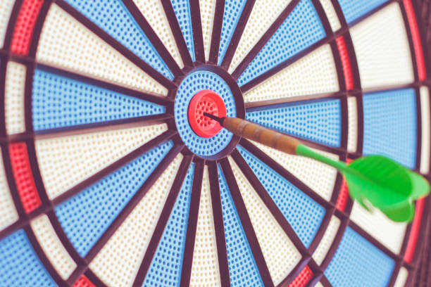 istock Dart arrow hit on target center 1172290003
