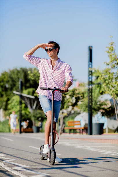 istock Young man on electric scooter during sunny day 1172290778