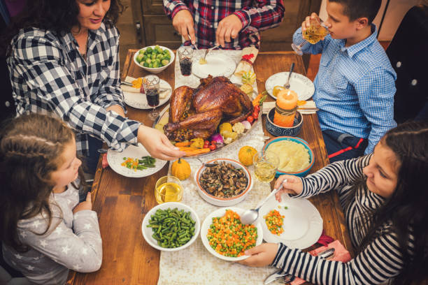 istock Family having traditional thanksgiving dinner at home 1172292535