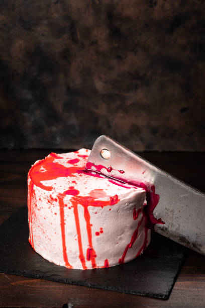 istock Bleeding monster cake with a knife on dark background 1172293186