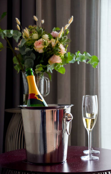 istock Romantic celebrations with flower bouquet and champagne 1172293272
