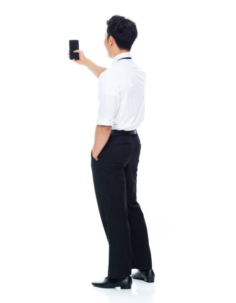 rear view / full length / one man only of 20-29 years old adult handsome people chinese ethnicity / east asian ethnicity male / young men manager / businessman / business person standing in front of white background wearing a suit - beautiful men young adult 25 30 years imagens e fotografias de stock