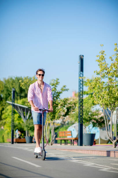 istock Young man on electric scooter during sunny day 1172294342