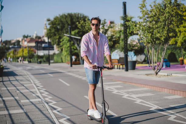 istock Young man on electric scooter during sunny day 1172295086