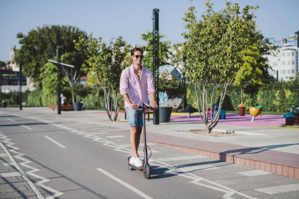 istock Young man on electric scooter during sunny day 1172296064