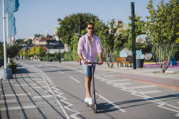 istock Young man on electric scooter during sunny day 1172296117