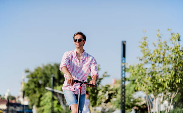 istock Young man on electric scooter during sunny day 1172296212