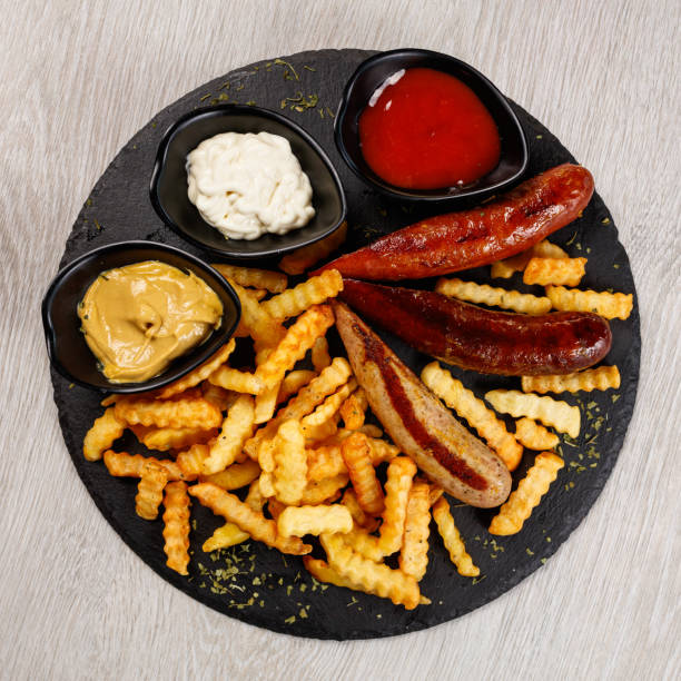 istock Delicious sausage served with fries 1172296336