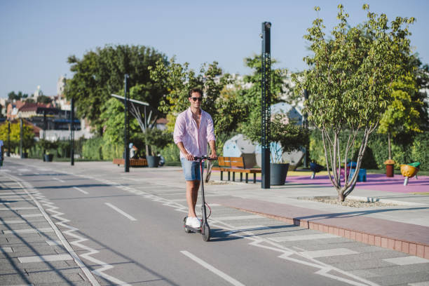 istock Young man on electric scooter during sunny day 1172296500