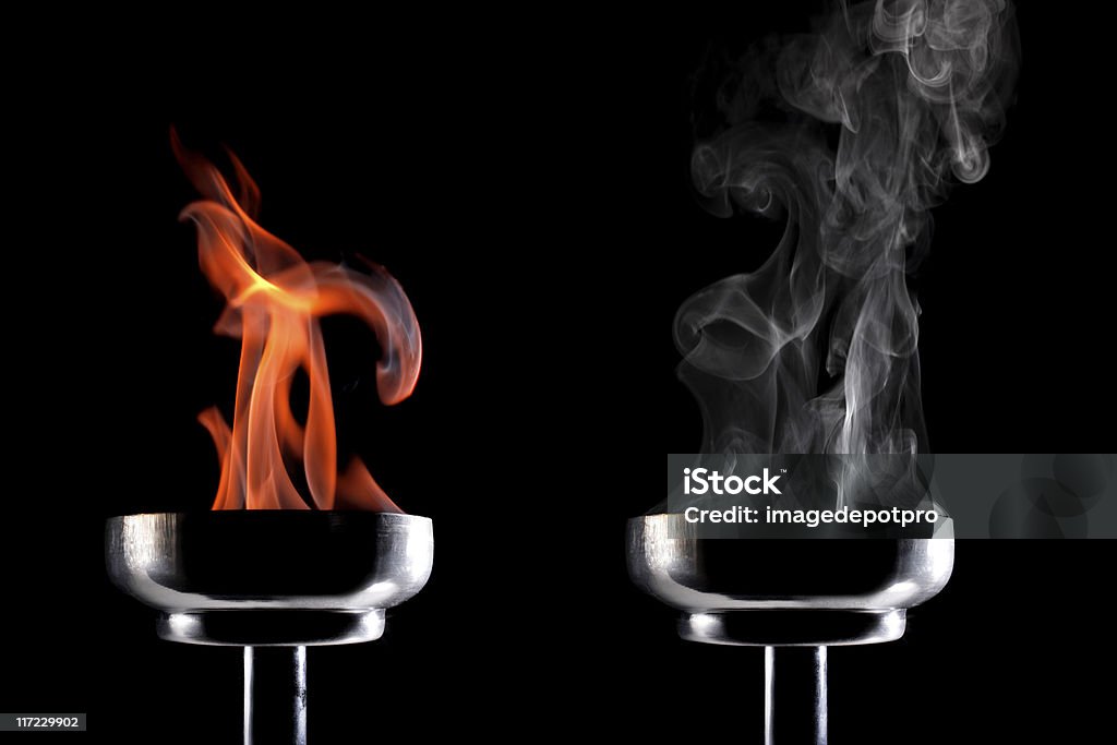 power burning and smoking flaming torch. Flaming Torch Stock Photo