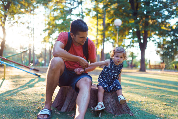 istock Father and daughter in park 1172300120