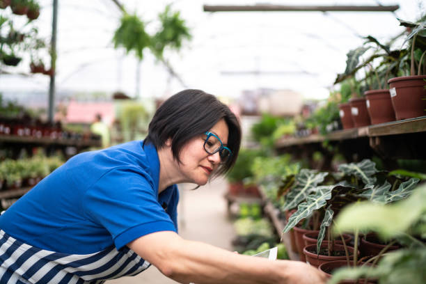 istock Florist Using Tablet at Small Business Flower Shop 1172301860