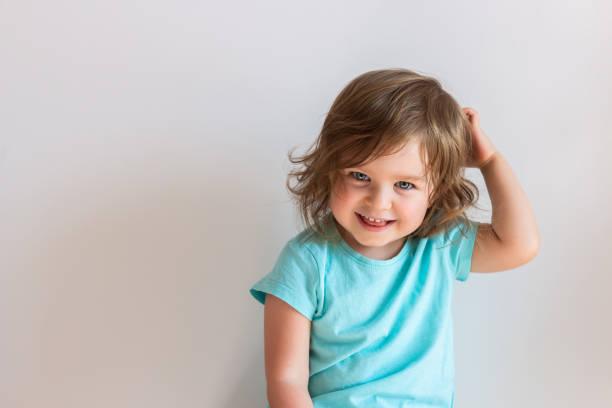 happy laughing baby toddler kid on light background - shirt lifestyles close up cheerful imagens e fotografias de stock