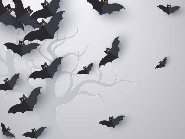 Flying bats background with copy space. Flying bats background with copy space. 3d paper cut style. Grey background with tree silhouette for Halloween holiday. Vector illustration. flock of bats stock illustrations