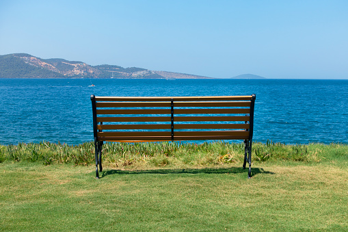 Park benches on the edge of the sea