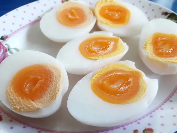 Halved boiled eggs, eaten with other Thai food