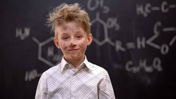 istock Little hooligan making explosion on chemistry lesson, naughty boy in school 1172311740