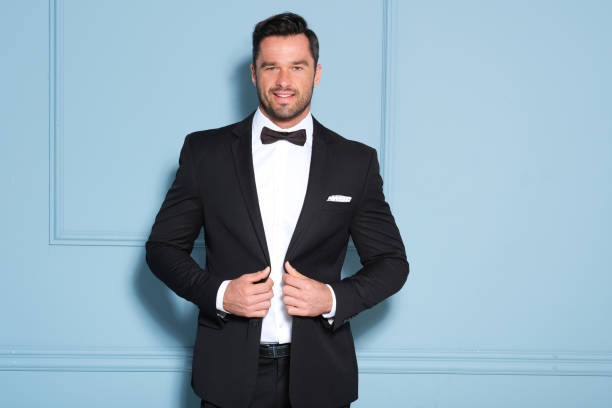 Handsome man in black classy suit. Elegant man in black suit on. tuxedo stock pictures, royalty-free photos & images