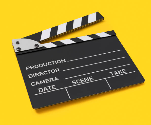 istock Movie clapper board on yellow background 1172328017