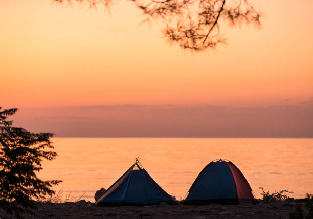 istock Two tents on the beach at sunrise 1172331995