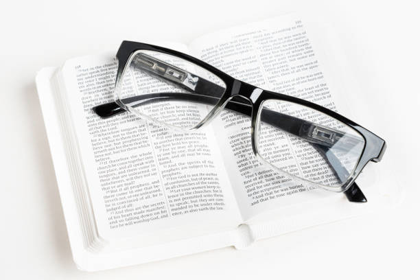istock White Pocket Bible With A Pair Of Reading Glasses 1172333398
