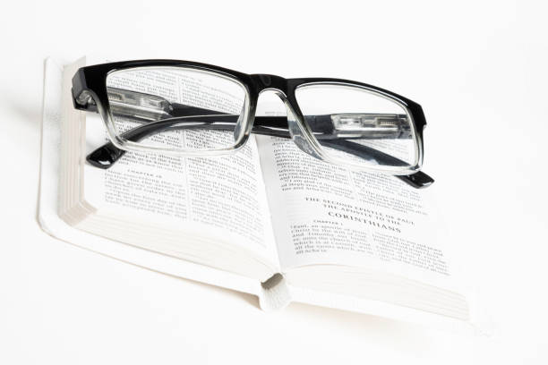 istock White Pocket Bible With A Pair Of Reading Glasses 1172333428