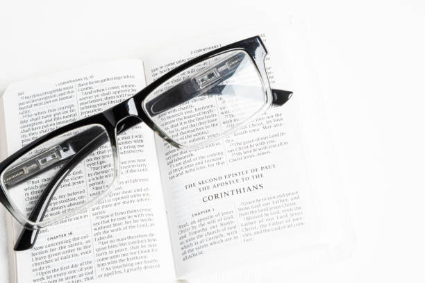 istock White Pocket Bible With A Pair Of Reading Glasses 1172333455