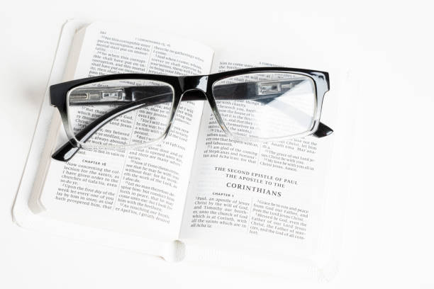 istock White Pocket Bible With A Pair Of Reading Glasses 1172333569