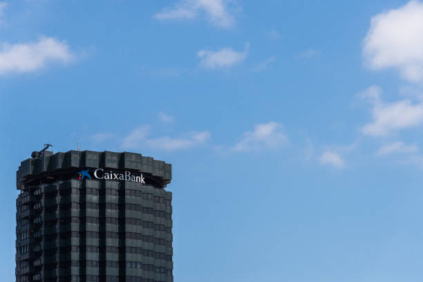 Building with signs of CaixaBank bank stock photo