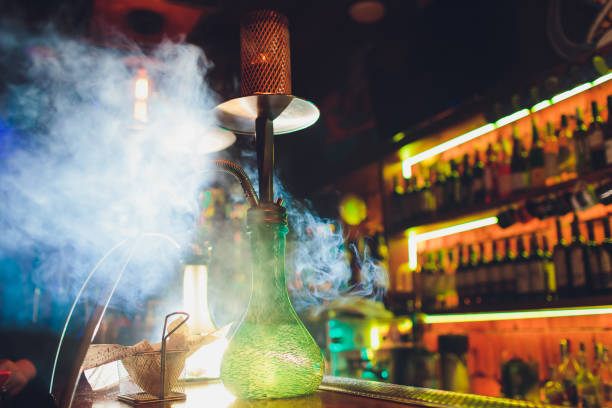 istock Process of making hookah for smoking. concept of smoking a hookah and having a good time. hookah bowl on the dark background of the bar close up view. Toned image. 1172338067