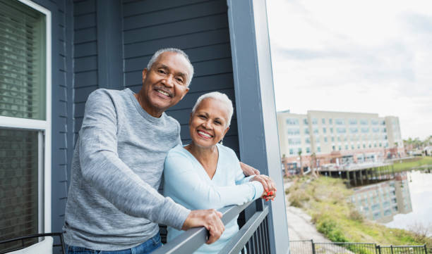 istock Senior couple looking at view from balcony 1172340171