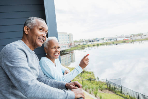 istock Senior couple looking at view from balcony 1172340183