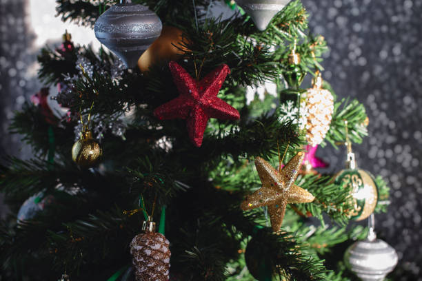 istock Christmas tree festive background. Xmas decor toy balls snowflake cone sequins star snowflake. 1172343476
