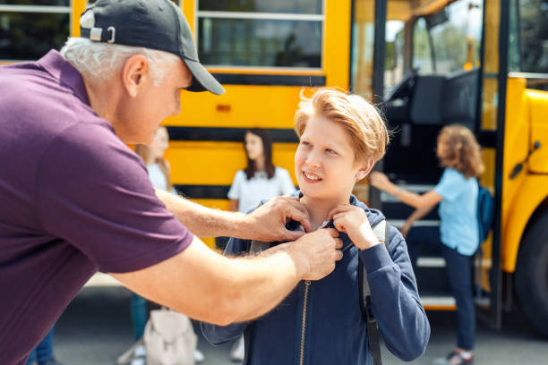 istock Father helping son with grooming before going to school by bus close-up 1172343573