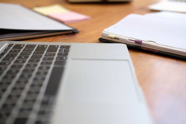 istock computer notebook stationary on library desk. back to school learning education concept 1172344295