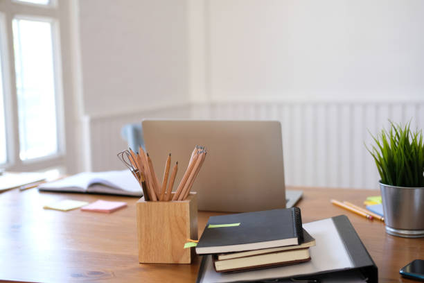 istock computer notebook stationary on library desk. back to school learning education concept 1172344300