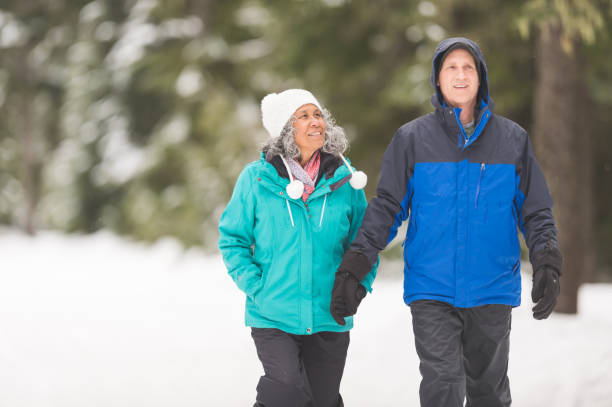 istock A senior couple snowshoeing in the forest 1172345985