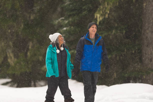 istock A senior couple snowshoeing in the forest 1172345992
