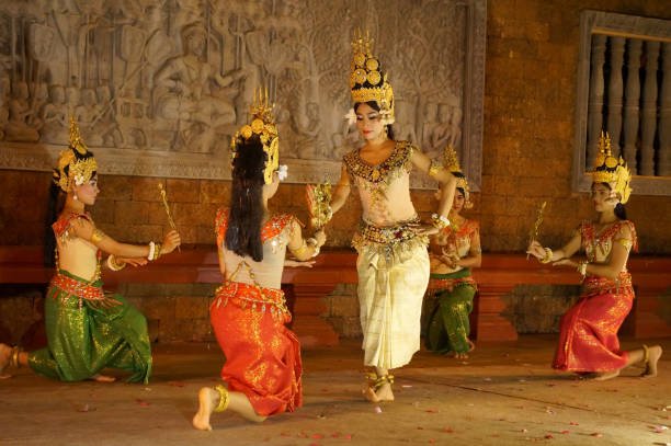 SIEM REAP, CAMBODIA - Aughust 8th , 2016:Khmer classical dancers performing in traditional costume . Apsara Dance is the ancient classical dance form of Cambdia. SIEM REAP, CAMBODIA - Aughust 8th , 2016:Khmer classical dancers performing in traditional costume . Apsara Dance is the ancient classical dance form of Cambdia. khmer stock pictures, royalty-free photos & images