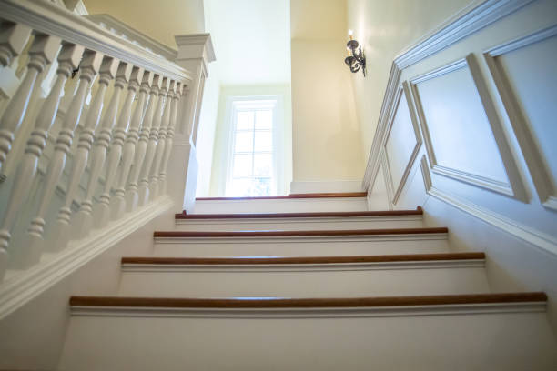 Grand Foyer Down Beautiful Winding Hardwood Staircase in Showcase Home