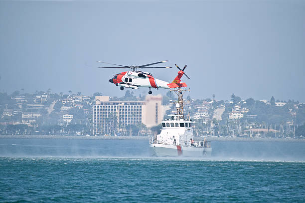 Coast Guard boat and helicopter in the bay stock photo