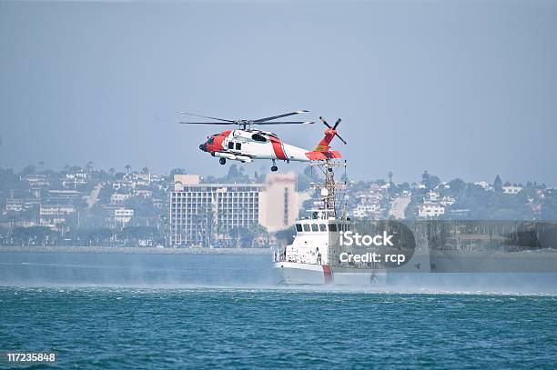 Coast Guard Boat And Helicopter In The Bay Stock Photo - Download Image Now - Coast Guard, Helicopter, Accidents and Disasters