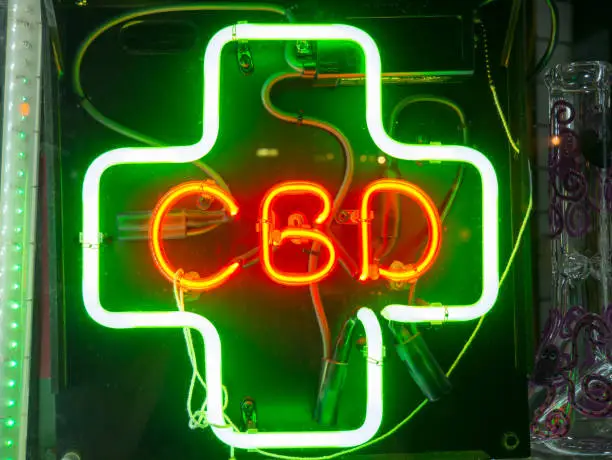 Photo of CBD Neon sign in a store front