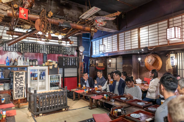 People Enjoying a Night Out at a Restaurant in Tokyo