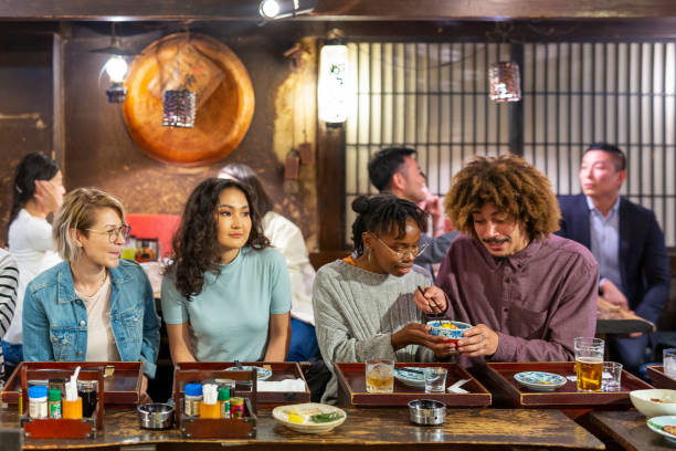 istock People Enjoying a Dinner and Drinks at a Restaurant in Tokyo 1172360899