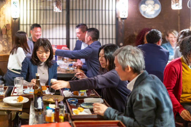istock People Enjoying a Dinner and Drinks at a Restaurant in Tokyo 1172360902