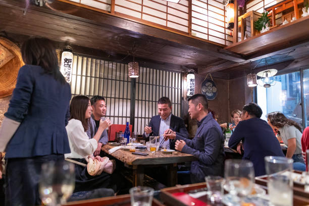 istock People Enjoying a Dinner and Drinks at a Restaurant in Tokyo 1172360910