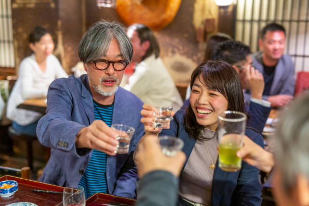 Middle Aged People Having Dinner Together in a Restaurant